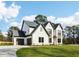 Charming two-story home with a three-car garage and well-manicured lawn at 3735 Tamiami Trl, Cumming, GA 30041