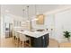 Modern kitchen featuring a large island, stainless steel appliances, pendant lighting, and white cabinetry at 3735 Tamiami Trl, Cumming, GA 30041