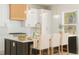 Elegant kitchen featuring a large island with seating and modern appliances at 3735 Tamiami Trl, Cumming, GA 30041