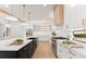 Spacious kitchen with custom cabinets, a large island with seating, and stainless steel appliances at 3735 Tamiami Trl, Cumming, GA 30041