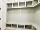 Convenient mudroom with built-in storage, coat hooks, and a bench for easy organization at 3735 Tamiami Trl, Cumming, GA 30041