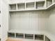 Large mudroom with custom built-in storage lockers, shelving, and seating at 3735 Tamiami Trl, Cumming, GA 30041