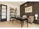 Spacious home office featuring built in shelving, designer paint and modern furnishings at 3735 Tamiami Trl, Cumming, GA 30041