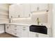 A well-organized pantry with ample shelving, cabinets, countertop space, and black undermount sink at 3735 Tamiami Trl, Cumming, GA 30041