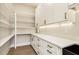 A well-organized pantry with ample shelving, cabinets, and countertop space at 3735 Tamiami Trl, Cumming, GA 30041