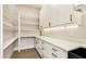 A well-organized pantry with ample shelving, cabinets, and countertop space at 3735 Tamiami Trl, Cumming, GA 30041