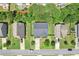 Overhead aerial view of a home with a well-kept lawn, driveway, and surrounding houses at 6160 Oriole Ln, Cumming, GA 30028