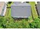 Aerial view of the home with a well manicured backyard, landscaping, and a patio at 6160 Oriole Ln, Cumming, GA 30028