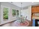 Charming breakfast nook with a sunny window, stylish table, and easy access to the backyard at 6160 Oriole Ln, Cumming, GA 30028