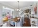 Open-concept dining area with natural light, hardwood floors, and seamless flow to living area at 6160 Oriole Ln, Cumming, GA 30028