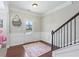 Inviting entryway with beautiful floors, staircase, and decorative details at 6160 Oriole Ln, Cumming, GA 30028