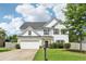 Charming two-story home with a well-maintained lawn and inviting curb appeal at 6160 Oriole Ln, Cumming, GA 30028