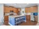 Gourmet kitchen with stainless steel appliances, granite countertops, and dark wood flooring at 6160 Oriole Ln, Cumming, GA 30028