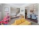 Open-concept living area with a staircase, hardwood floors, and seamless flow to the dining area at 6160 Oriole Ln, Cumming, GA 30028