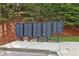 Community mailboxes are conveniently located near a landscaped area with mature trees at 6160 Oriole Ln, Cumming, GA 30028