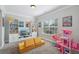 Bright playroom features built-in shelves, large window, and plush carpet, perfect for to play at 6160 Oriole Ln, Cumming, GA 30028