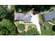 An aerial view of the roof, driveway, and landscaping at 6960 Hunters Branch Dr, Atlanta, GA 30328
