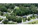 An aerial view of the property surrounded by mature trees at 6960 Hunters Branch Dr, Atlanta, GA 30328