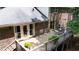 Home back deck with furniture and potted plants, overlooking the backyard at 6960 Hunters Branch Dr, Atlanta, GA 30328