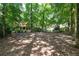 Spacious, flat backyard shaded by mature trees at 6960 Hunters Branch Dr, Atlanta, GA 30328