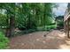 A view of the backyard with its mature trees and peaceful surroundings at 6960 Hunters Branch Dr, Atlanta, GA 30328