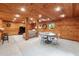Spacious basement featuring wood paneling, recessed lighting, and entertainment area at 6960 Hunters Branch Dr, Atlanta, GA 30328