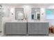 Chic bathroom with double vanity and large mirrors at 6960 Hunters Branch Dr, Atlanta, GA 30328