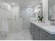Elegant bathroom with double vanity, glass shower, and hexagon tile flooring at 6960 Hunters Branch Dr, Atlanta, GA 30328