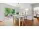 Bright dining area with a table, chairs, sliding door leading to the deck and breakfast bar at 6960 Hunters Branch Dr, Atlanta, GA 30328
