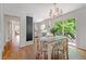 Bright dining room with hardwood floors and sliding glass doors leading to a deck at 6960 Hunters Branch Dr, Atlanta, GA 30328