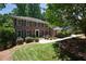 Exterior of the home with a well-manicured lawn and front yard landscaping at 6960 Hunters Branch Dr, Atlanta, GA 30328