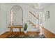 Inviting foyer with hardwood floors, staircase, and stylish decor at 6960 Hunters Branch Dr, Atlanta, GA 30328