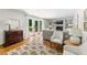 Inviting living room boasts hardwood floors, a fireplace, built-in shelving and french doors at 6960 Hunters Branch Dr, Atlanta, GA 30328