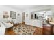 Cozy living room area with classic decor, framed artwork, and view of the kitchen at 6960 Hunters Branch Dr, Atlanta, GA 30328
