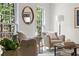 Cozy living room featuring natural light, neutral tones, and comfortable seating at 6960 Hunters Branch Dr, Atlanta, GA 30328