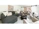 Comfortable living room with plush seating, modern decor, and a view of the staircase at 6960 Hunters Branch Dr, Atlanta, GA 30328