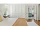 Light-filled main bedroom with hardwood floors and access to the en-suite bathroom with built-in storage at 6960 Hunters Branch Dr, Atlanta, GA 30328