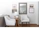 Charming sitting area with classic decor, framed artwork, and modern white furniture at 6960 Hunters Branch Dr, Atlanta, GA 30328