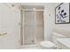 Well-lit bathroom with marble accents and a glass-enclosed shower at 75 14Th Ne St # 3820, Atlanta, GA 30309