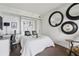 Stylish bedroom featuring a Murphy bed, a work station, and unique decorative mirrors at 75 14Th Ne St # 3820, Atlanta, GA 30309