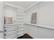 Walk-in closet with custom shelving and storage solutions at 75 14Th Ne St # 3820, Atlanta, GA 30309