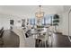 Bright and airy dining room with modern chandelier and floor-to-ceiling windows offering stunning city views at 75 14Th Ne St # 3820, Atlanta, GA 30309