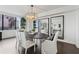 Bright dining room features an oval table, modern light fixture, and stunning city views at 75 14Th Ne St # 3820, Atlanta, GA 30309