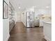 Modern kitchen featuring stainless steel appliances, white cabinets, and stylish shelving near the entryway at 75 14Th Ne St # 3820, Atlanta, GA 30309