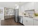 Beautiful kitchen featuring stainless steel appliances, marble countertops, and stylish built-in shelving at 75 14Th Ne St # 3820, Atlanta, GA 30309
