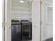 Convenient laundry area with full-size washer and dryer and ample shelving at 75 14Th Ne St # 3820, Atlanta, GA 30309