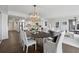 Inviting living space featuring a modern oval table, an open floorplan, and a bright kitchen at 75 14Th Ne St # 3820, Atlanta, GA 30309