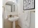 Chic powder room with pedestal sink and modern towel bars at 75 14Th Ne St # 3820, Atlanta, GA 30309