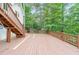 Large back deck, perfect for outdoor entertaining, with stairs leading to yard at 835 Timber Lake Trl, Cumming, GA 30041
