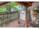 Fenced-in backyard featuring a storage shed and a wooded area at 835 Timber Lake Trl, Cumming, GA 30041